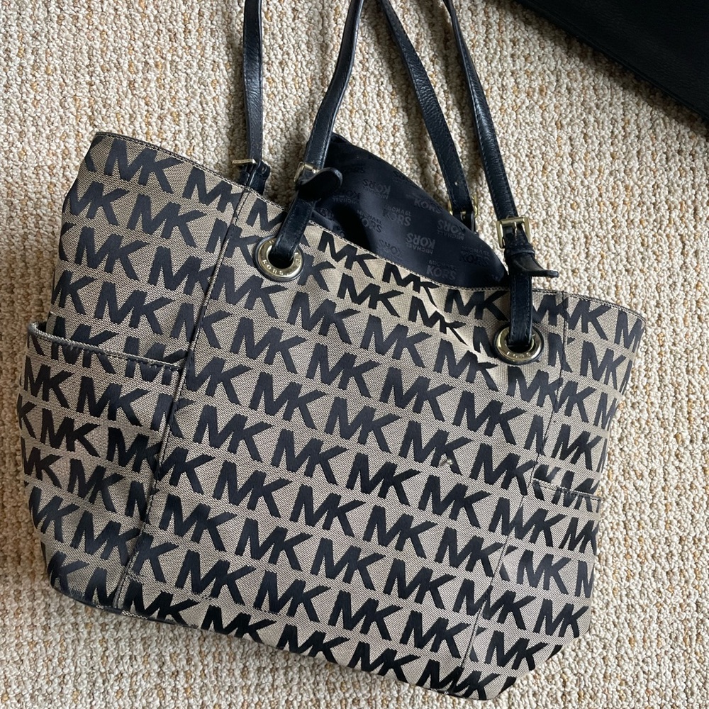 Michael Kors hand bag. Grayish/Tan with black logo and black leather straps.